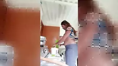 Chubby Desi gal while cooking can barely hide her perky XXX boobs
